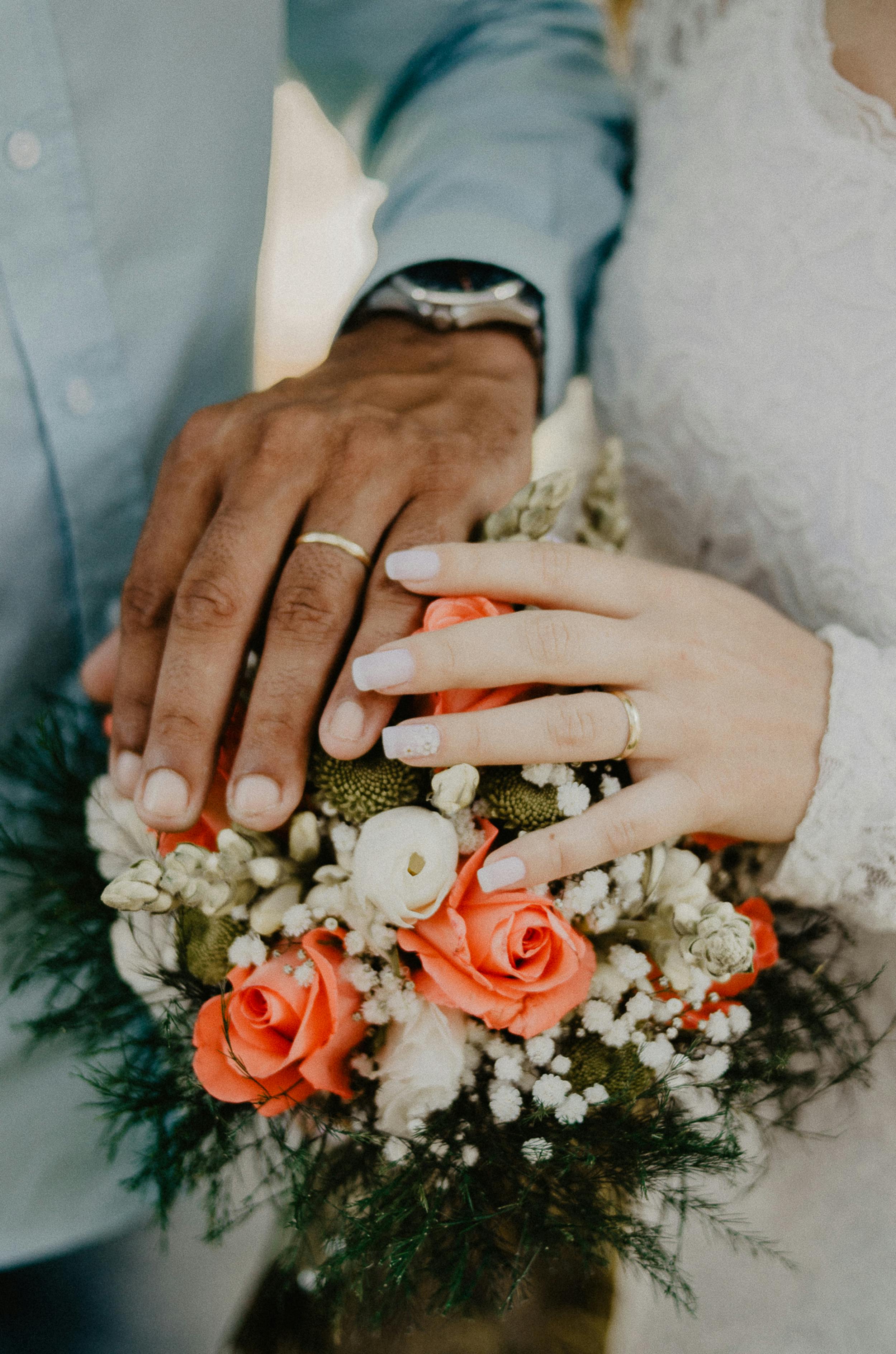 Couple's hands with their rings on