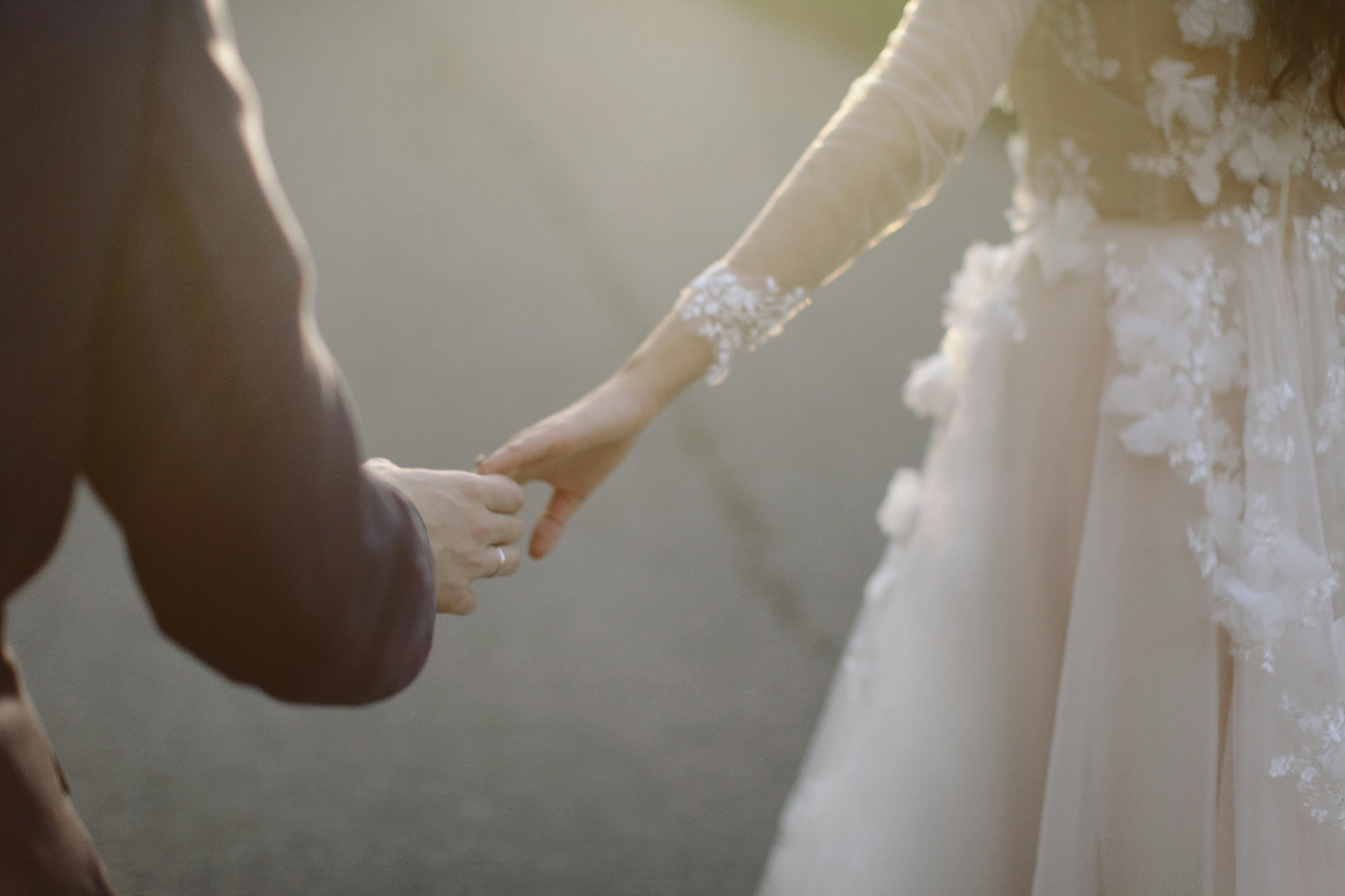 Couple holding hands while walking