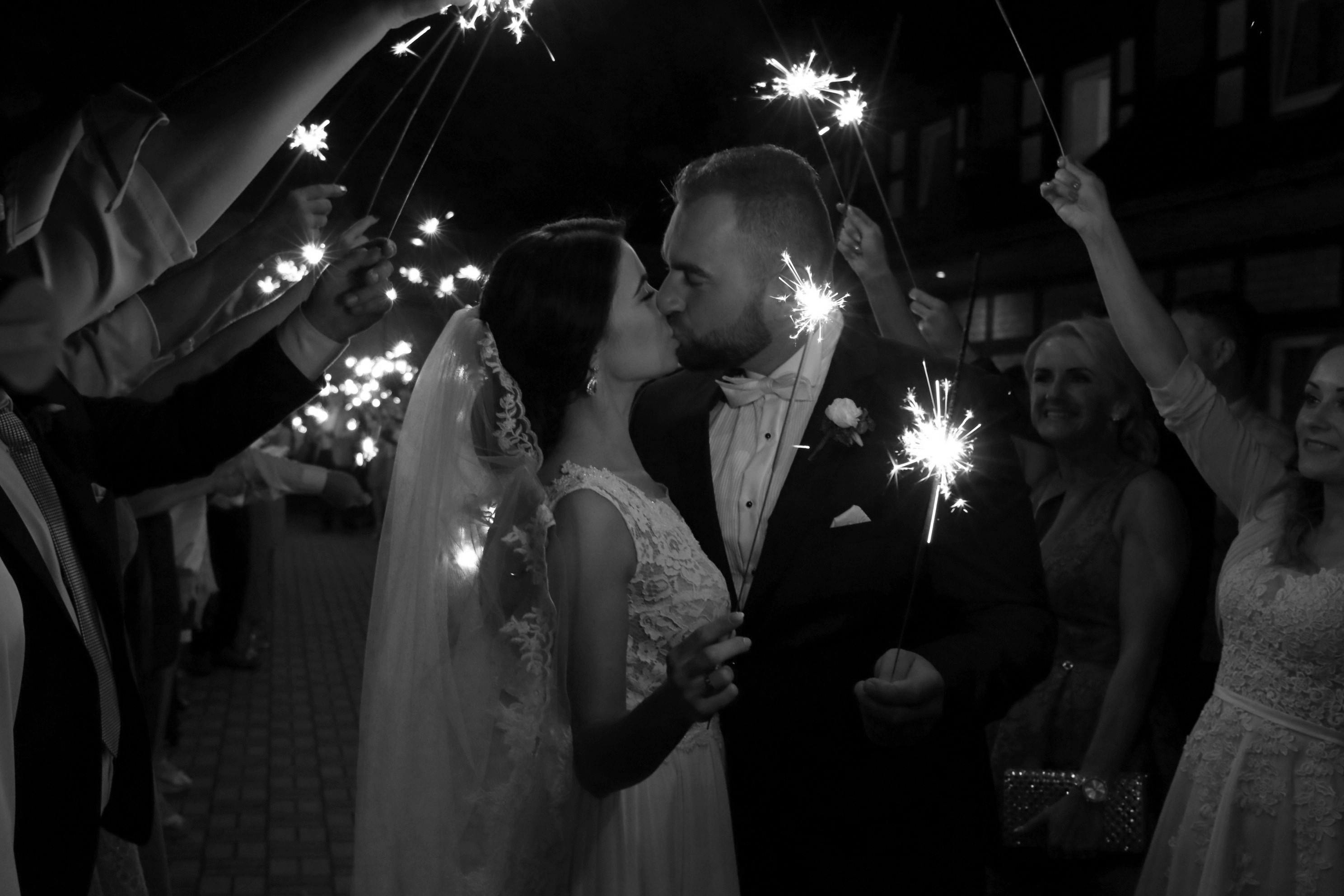An epic kiss under sparklers at the end of the day